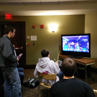 A group of students enjoying a game of Rock Band